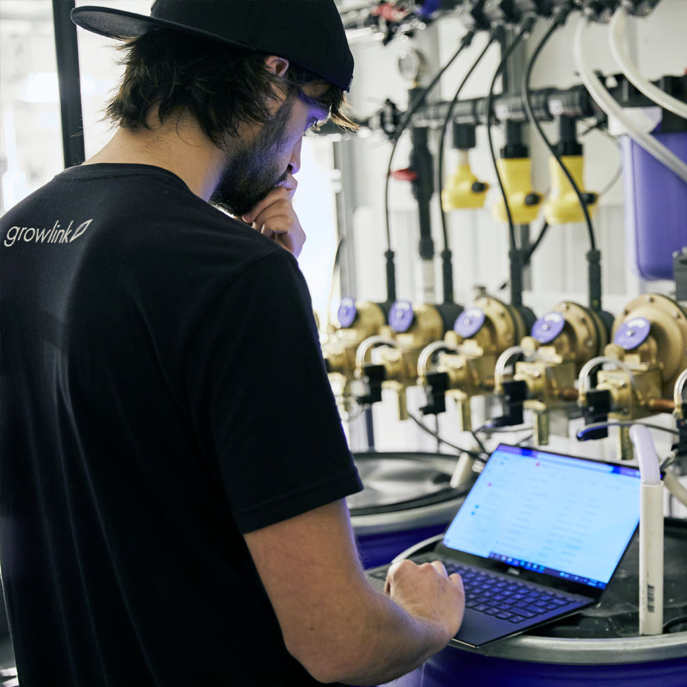Person using computer to control irrigation valves
